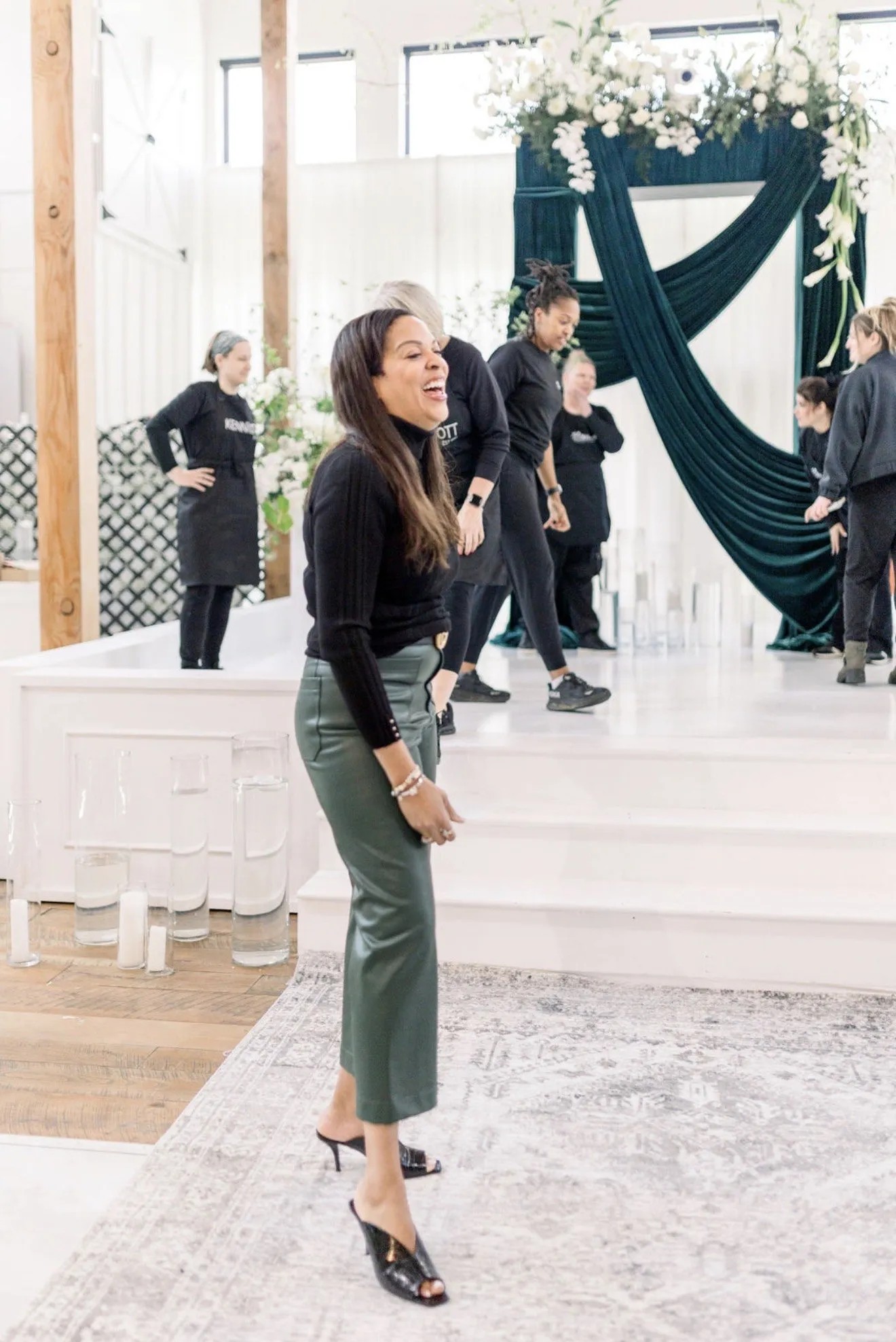 Christy reviewing the draped altar installation on set.
