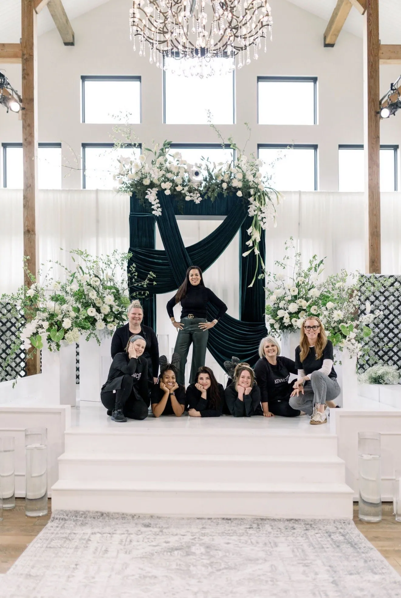 The floral team seated on the altar steps after install.