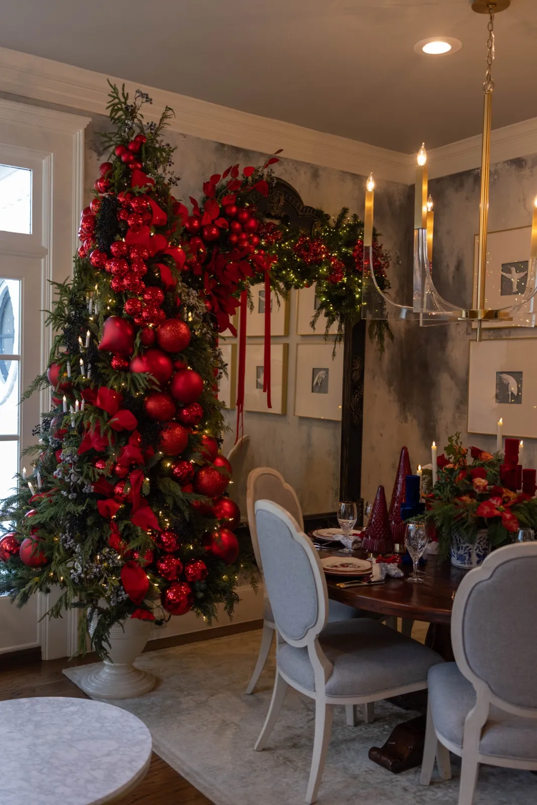Dining doorway arched in garland loaded with red apples and ornaments.